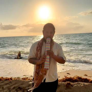Player on the beach at sunset
