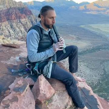 Player on a red-rock ledge